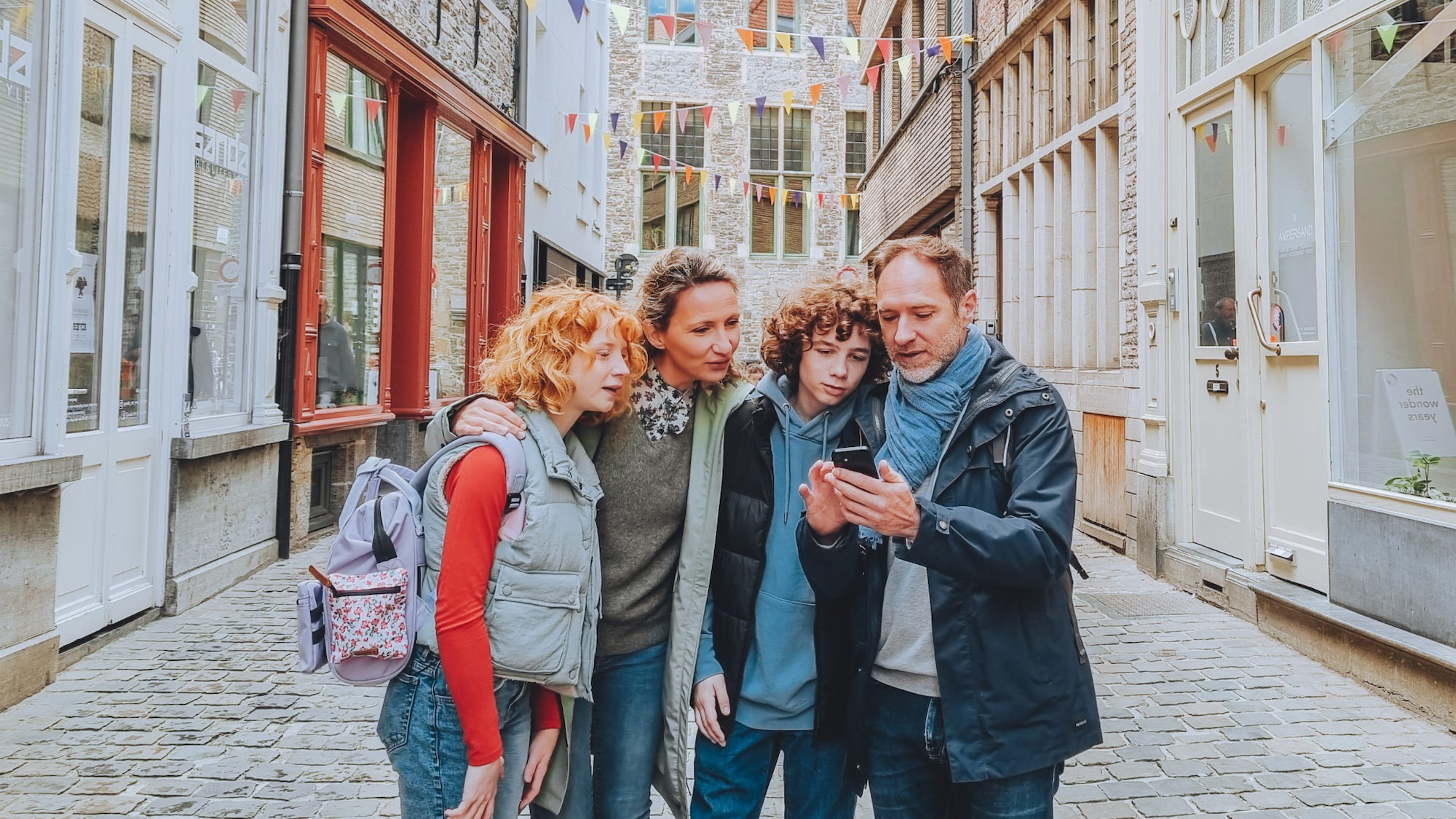 Family playing Coddy in city